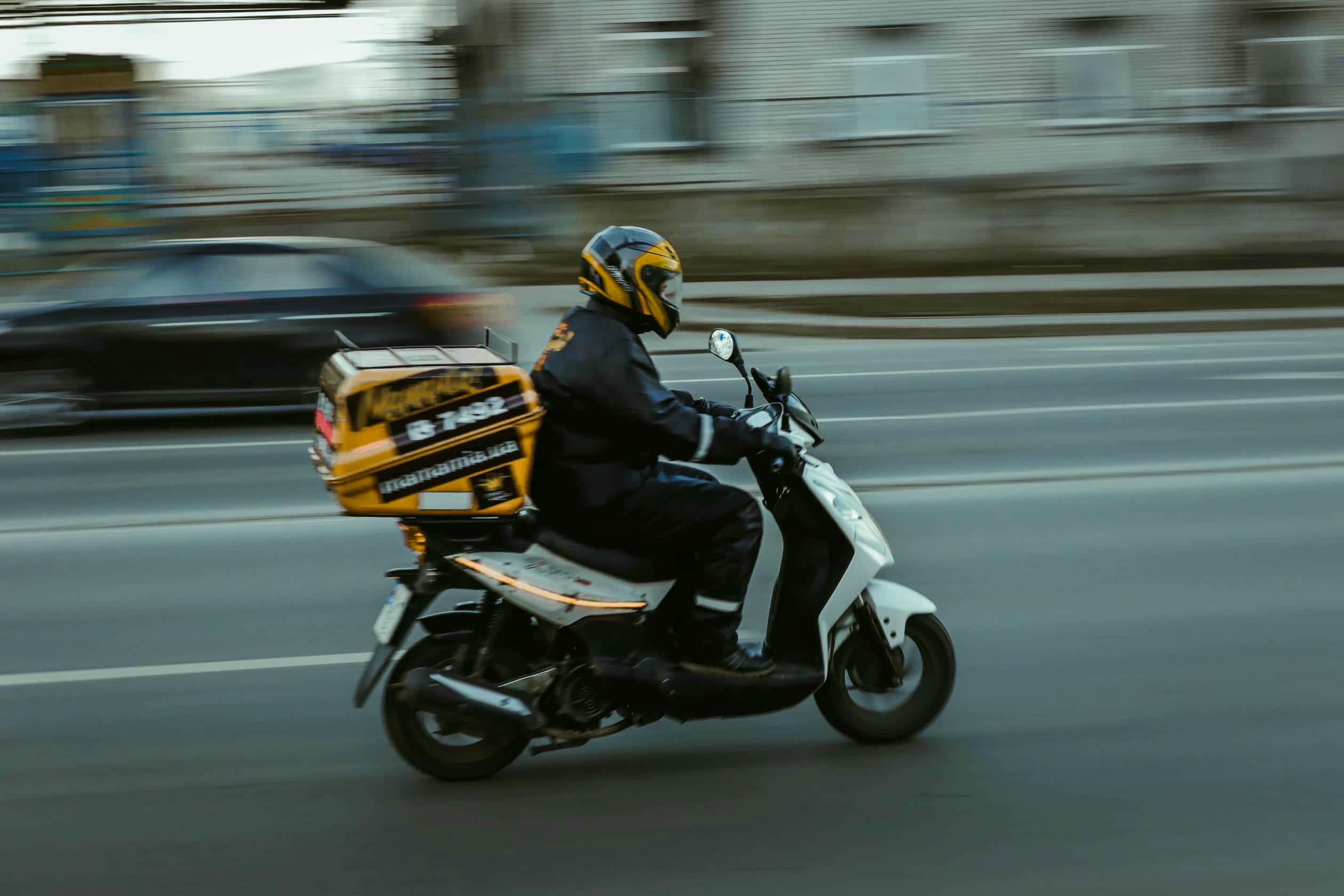 Logistics delivery person on a bike in a city